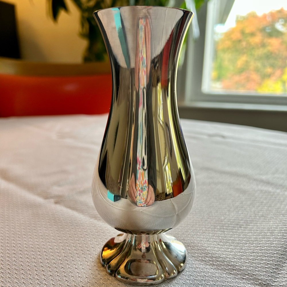 Silverplated quality heavy flower vase. Shiny nice piece for use or decor.